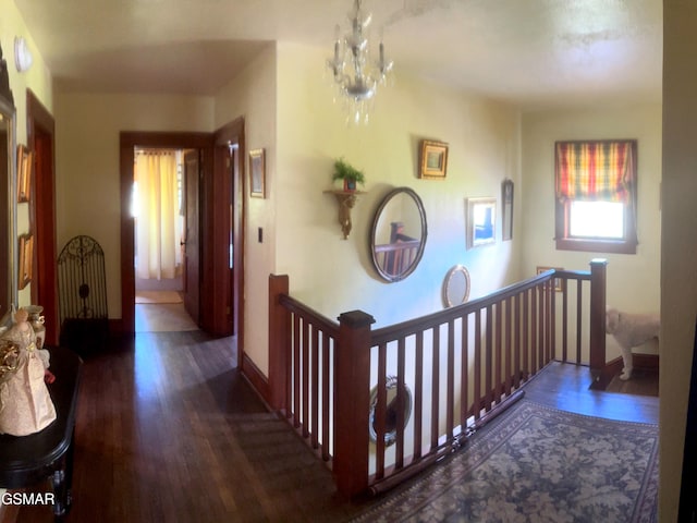 3451 Cosby Hwy, Cosby, TN 37722 - hall featuring baseboards, wood finished floors, an inviting chandelier, and an upstairs landing