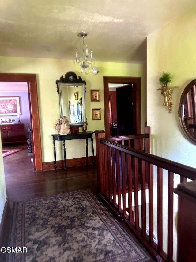 3451 Cosby Hwy, Cosby, TN 37722 - hallway with baseboards, a notable chandelier, and wood finished floors