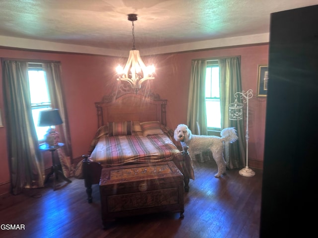 3451 Cosby Hwy, Cosby, TN 37722 - bedroom featuring wood finished floors, a notable chandelier, and multiple windows