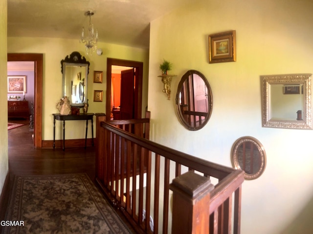3451 Cosby Hwy, Cosby, TN 37722 - corridor with wood finished floors, baseboards, and a notable chandelier
