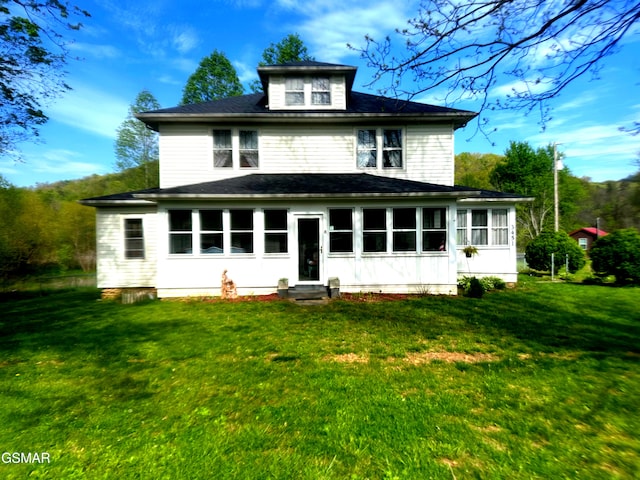 3451 Cosby Hwy, Cosby, TN 37722 - exterior space with entry steps, a sunroom, a front yard, and roof with shingles