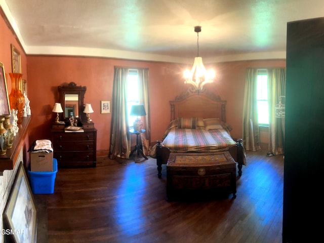 3451 Cosby Hwy, Cosby, TN 37722 - bedroom with baseboards, a notable chandelier, and wood finished floors