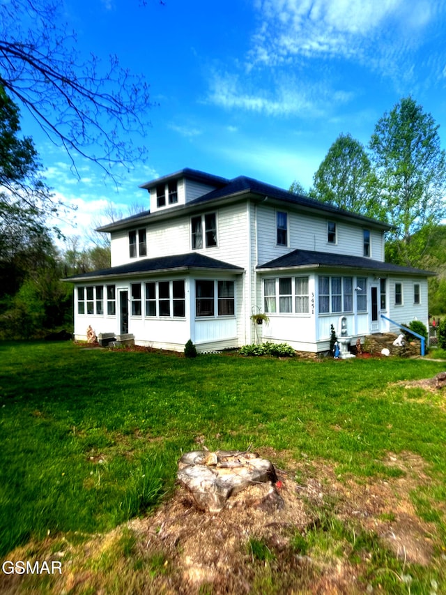 3451 Cosby Hwy, Cosby, TN 37722 - back of house featuring entry steps, a sunroom, and a yard