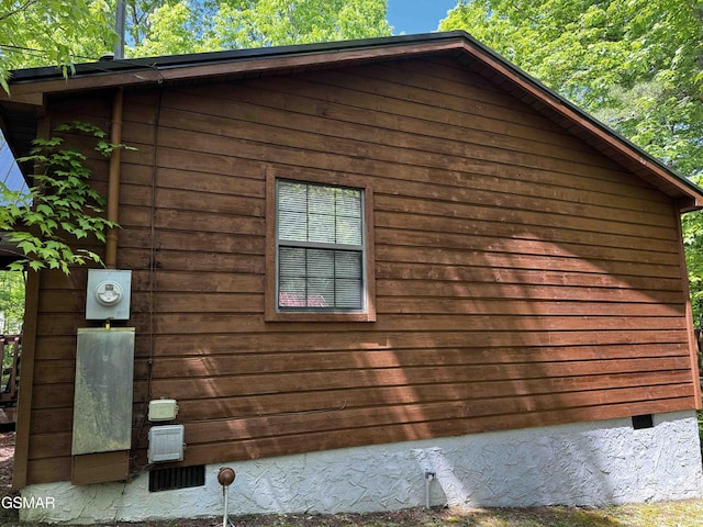 view of property exterior with crawl space