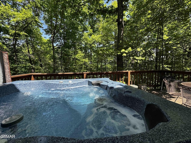 deck featuring a hot tub