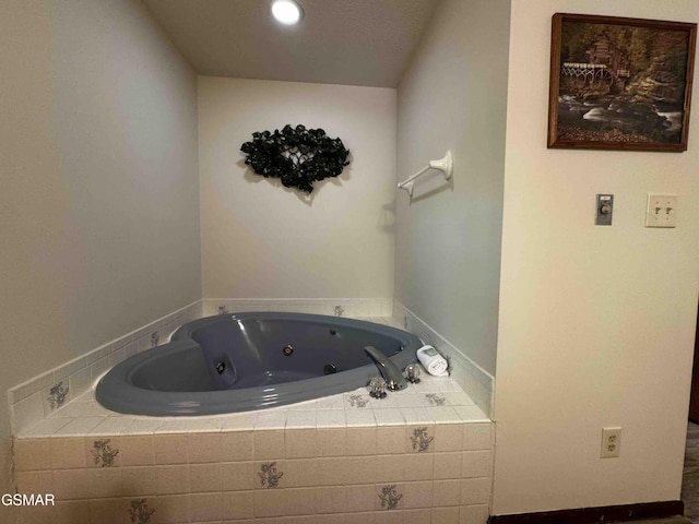 full bath featuring a whirlpool tub