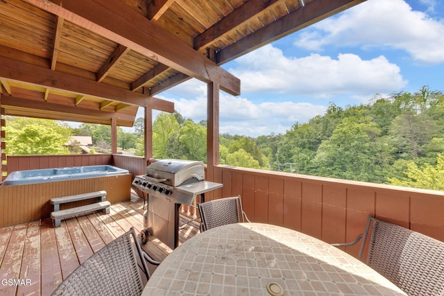 1619 Jed Trl, Sevierville, TN 37862 - wooden terrace featuring a hot tub, outdoor dining space, a wooded view, and grilling area