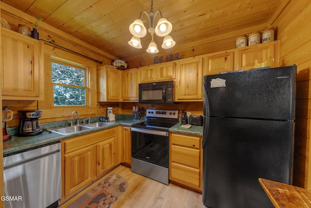 1619 Jed Trl, Sevierville, TN 37862 - kitchen with black appliances, a sink, a chandelier, dark countertops, and light wood-type flooring