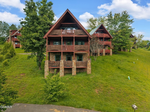 1619 Jed Trl, Sevierville, TN 37862 - rear view of house with a balcony, a yard, and a deck