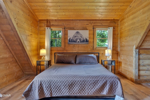 1619 Jed Trl, Sevierville, TN 37862 - bedroom featuring vaulted ceiling, wood ceiling, wood finished floors, and wood walls