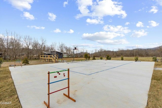 surrounding community featuring community basketball court