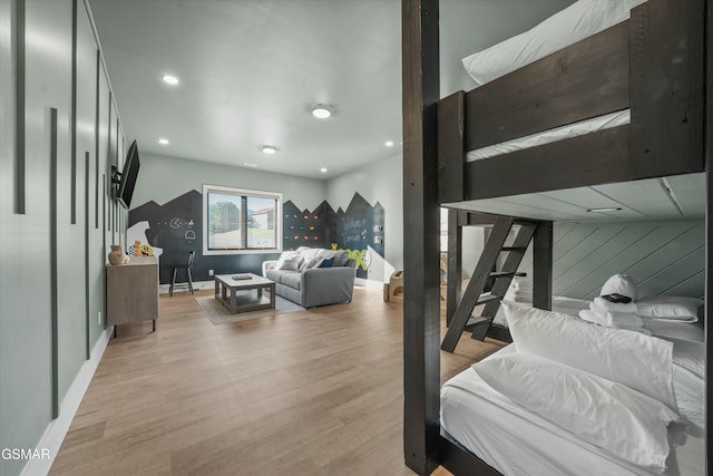 bedroom featuring light wood finished floors, baseboards, and recessed lighting