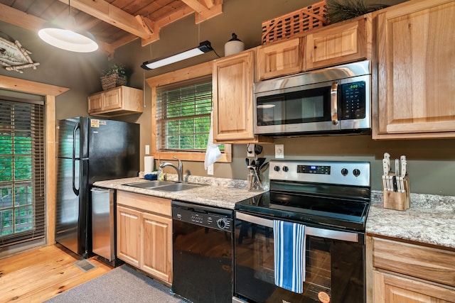 kitchen featuring wooden ceiling, beam ceiling, light brown cabinetry, black appliances, and a sink