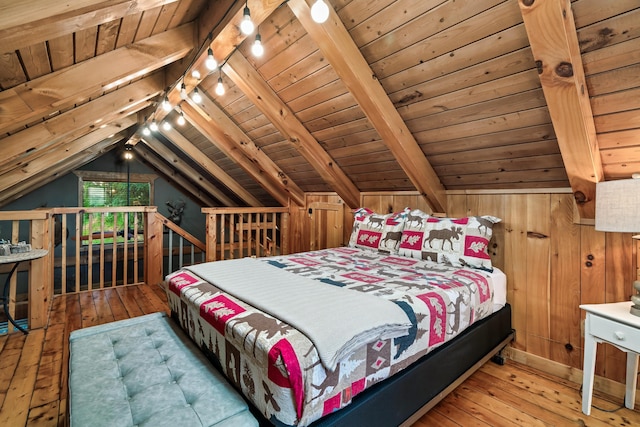 bedroom featuring lofted ceiling with beams, wood-type flooring, wooden walls, and wood ceiling