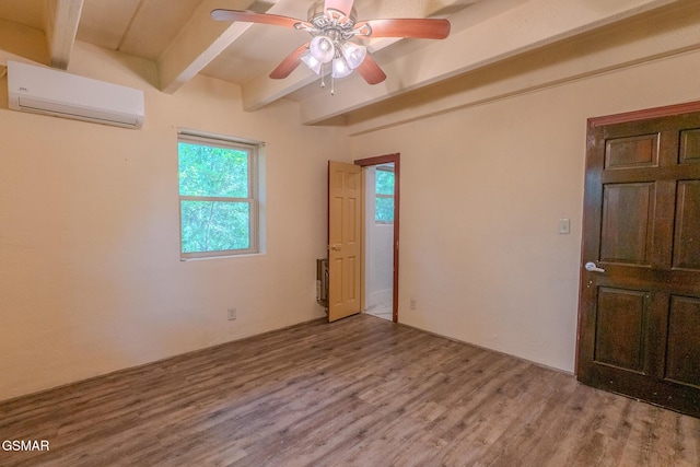 944 Smoky Mountain View Ct, Seymour, TN 37865 - empty room with a wall mounted air conditioner, beam ceiling, a ceiling fan, and wood finished floors