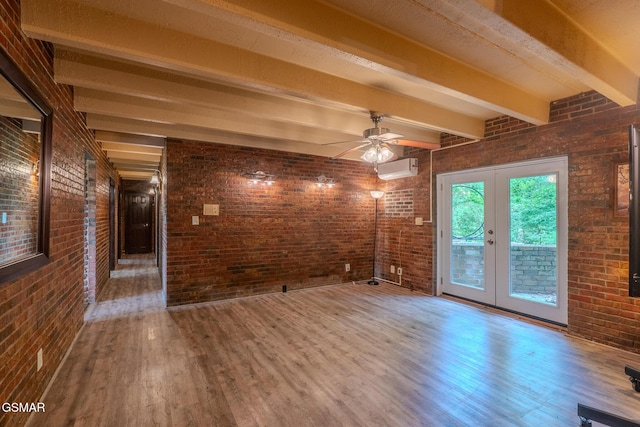 944 Smoky Mountain View Ct, Seymour, TN 37865 - spare room with wood finished floors, beamed ceiling, french doors, brick wall, and a ceiling fan