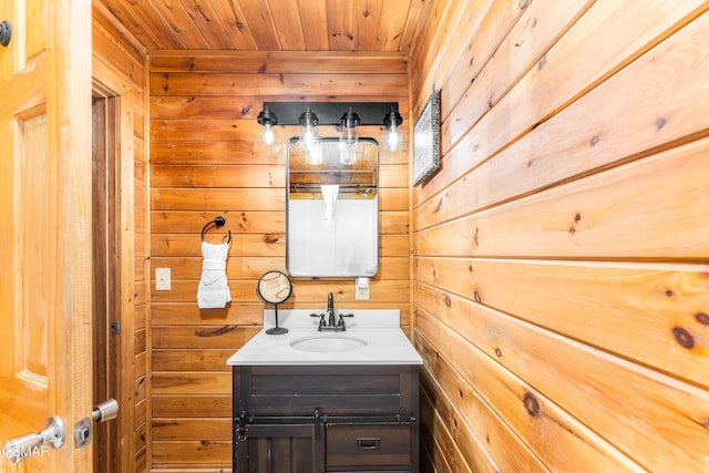 3186 Emerald Springs Loop, Pigeon Forge, TN 37862 - bathroom featuring wooden walls, vanity, and wooden ceiling