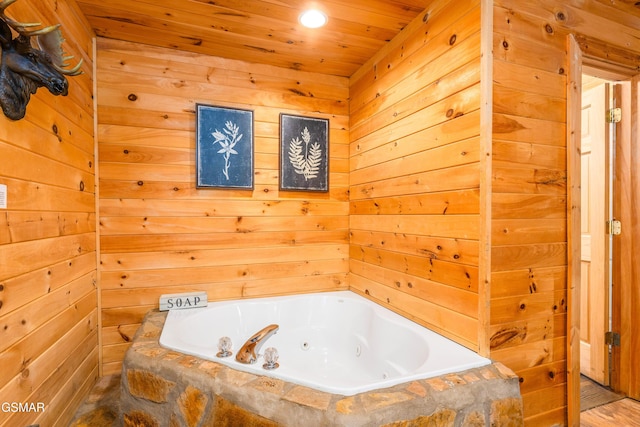 3186 Emerald Springs Loop, Pigeon Forge, TN 37862 - bathroom featuring a whirlpool tub, wood ceiling, wooden walls, and recessed lighting