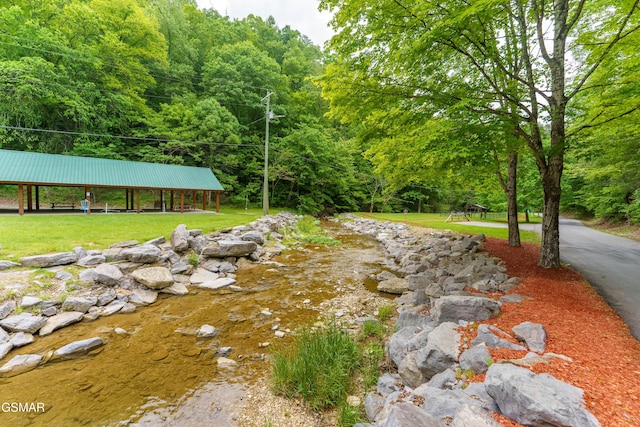 3186 Emerald Springs Loop, Pigeon Forge, TN 37862 - view of green lawn featuring a view of trees