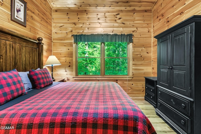 3828 Saddle Brook Way, Sevierville, TN 37862 - bedroom featuring light wood-type flooring and wooden walls