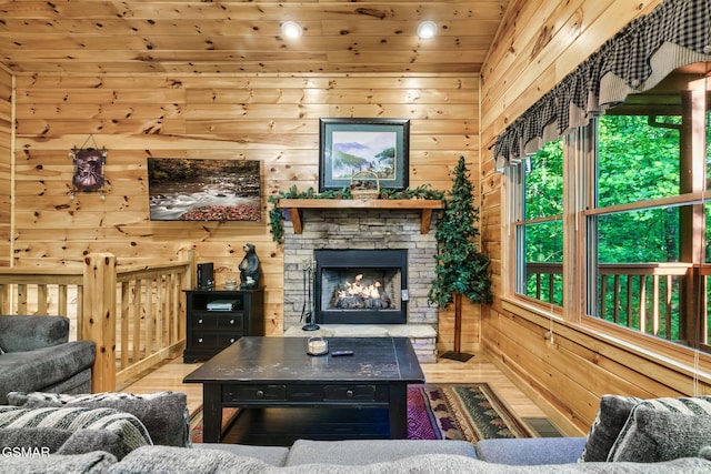 3828 Saddle Brook Way, Sevierville, TN 37862 - living area featuring wooden walls, wood finished floors, and a fireplace