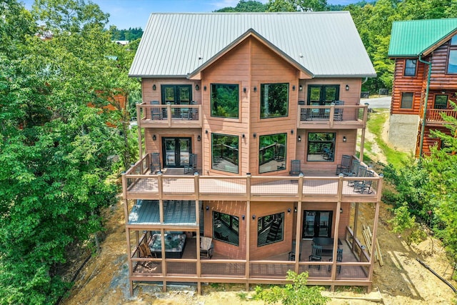 rear view of house with a balcony