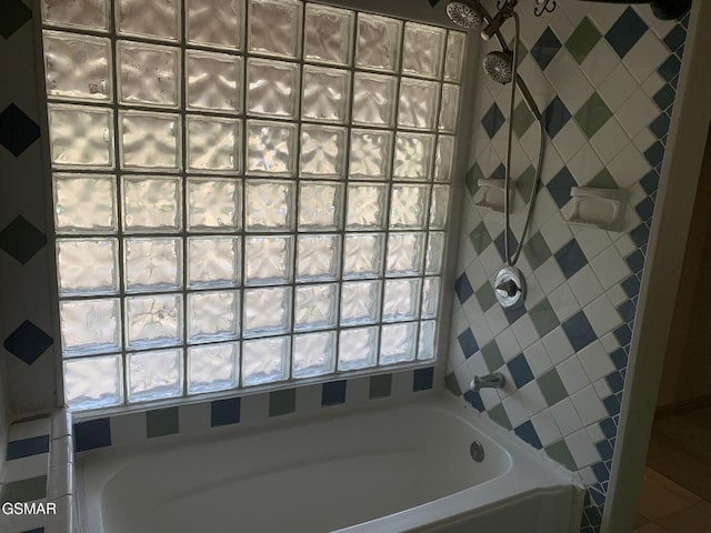 bathroom with a tile shower