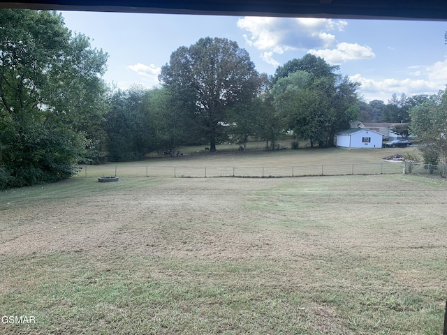 view of yard with a rural view