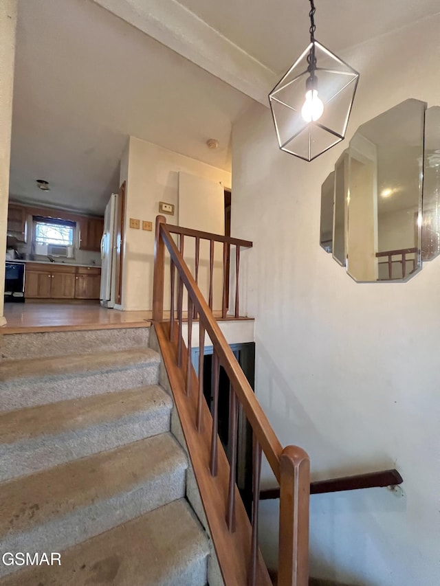 stairway with wood finished floors