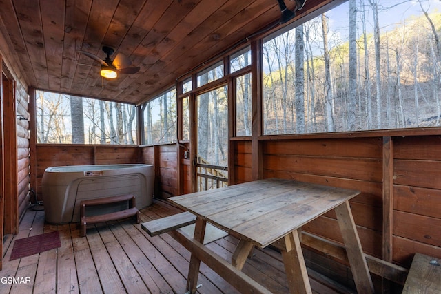 sunroom featuring wooden ceiling and ceiling fan