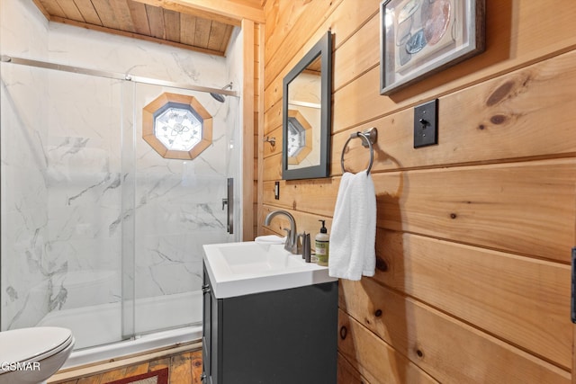 bathroom with wooden walls, a marble finish shower, toilet, wood ceiling, and vanity