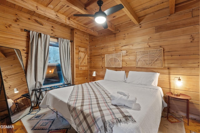 bedroom with wood ceiling, beamed ceiling, wood walls, and wood finished floors