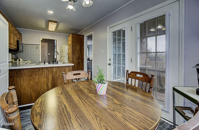 dining area featuring dark hardwood / wood-style flooring and sink