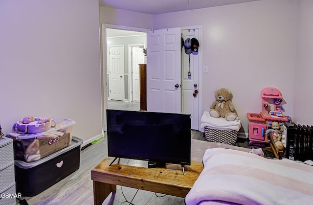 bedroom with a closet and hardwood / wood-style flooring