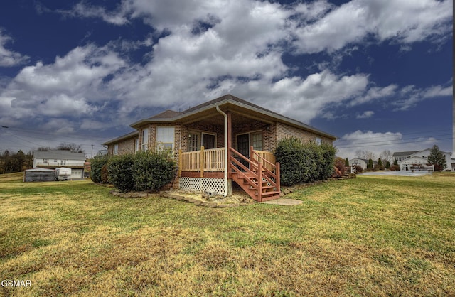 view of front of property with covered porch and a front yard