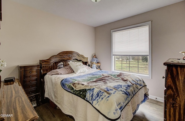 bedroom featuring hardwood / wood-style flooring