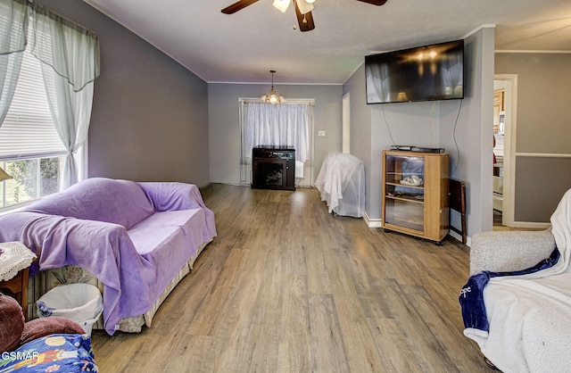 living room featuring hardwood / wood-style flooring and ceiling fan