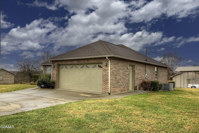 view of side of property with cooling unit, a garage, and a yard