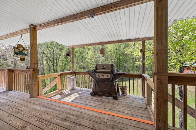 wooden deck featuring area for grilling