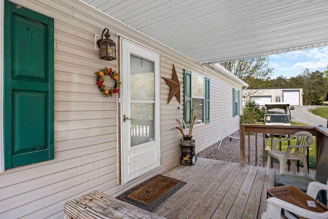 wooden terrace featuring covered porch