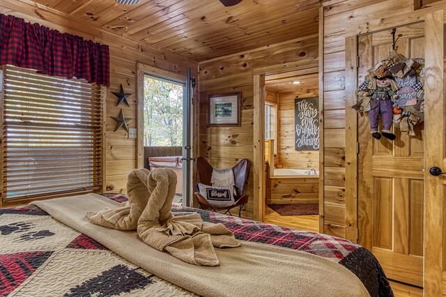 bedroom with wood walls and wooden ceiling