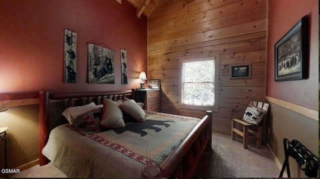 carpeted bedroom with wooden walls, wood ceiling, and vaulted ceiling