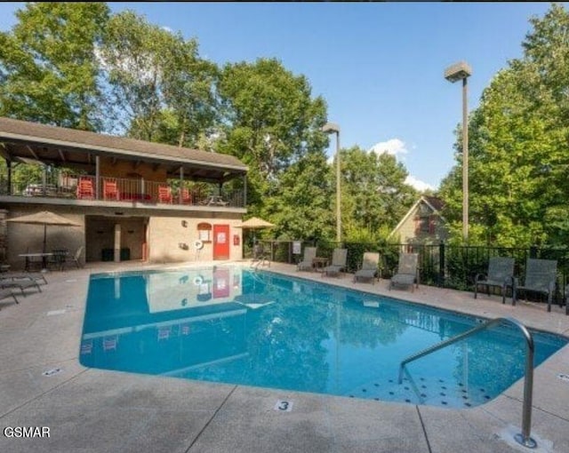 view of swimming pool with a patio area