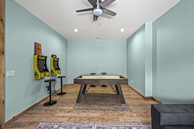 playroom with ceiling fan and hardwood / wood-style flooring