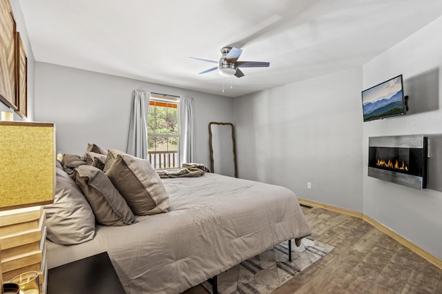 bedroom featuring light hardwood / wood-style floors and ceiling fan