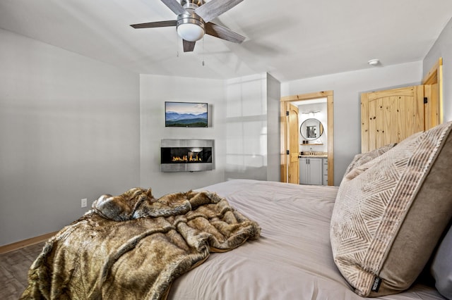 bedroom with connected bathroom and ceiling fan