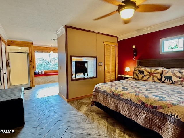 bedroom with crown molding, a closet, ceiling fan, and parquet flooring