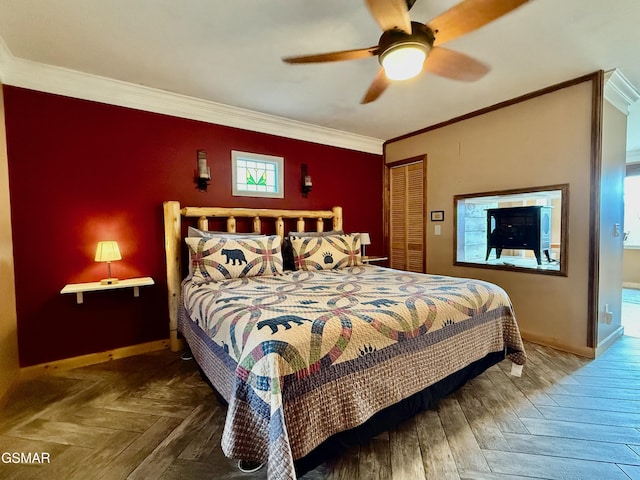 bedroom with parquet floors, a closet, crown molding, and ceiling fan