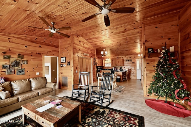 living room featuring wood walls, light wood-type flooring, lofted ceiling, and wood ceiling