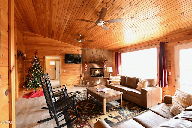 living room featuring a healthy amount of sunlight, lofted ceiling, and wooden ceiling